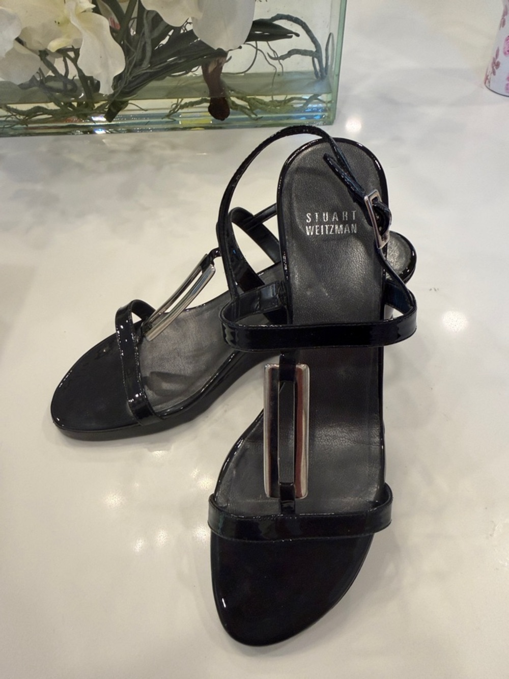 Stuart Weitzman Black Patent Leather T-Strap Sandals with Silver Bar